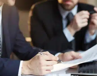 People examining a solar agreement for termination; SCRC provides a legal path to cancel solar contracts permanently.