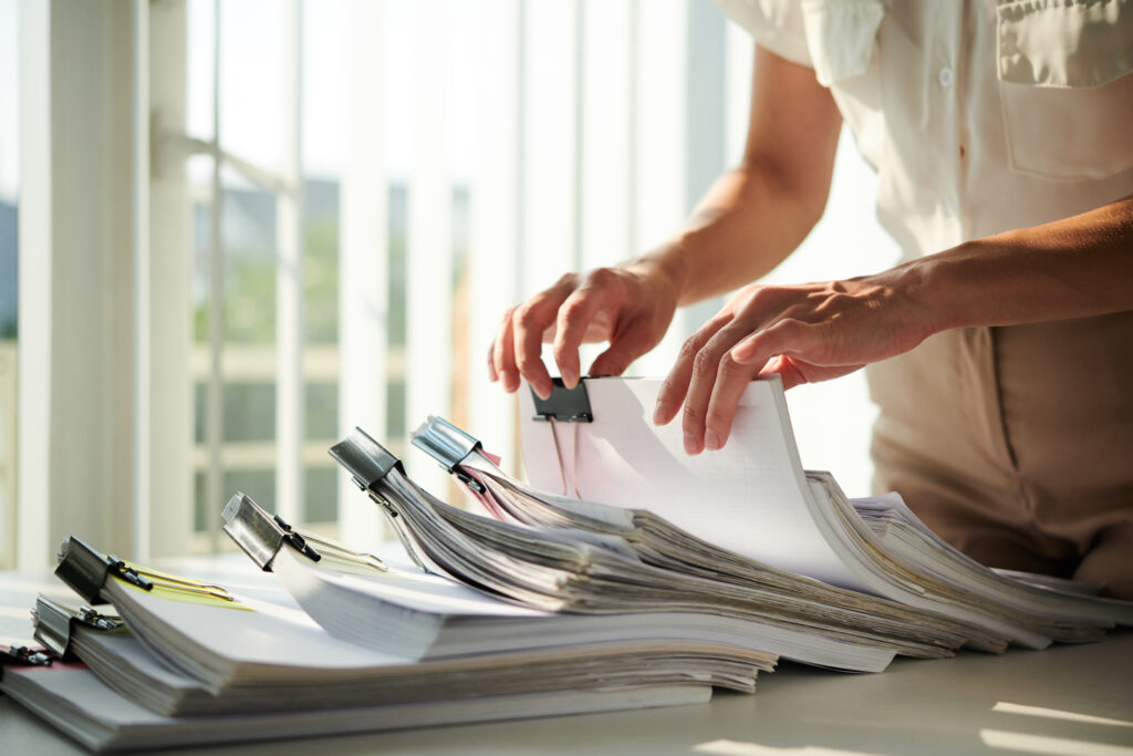 SCRC representatives looking through and organizing a homeowners contract. 