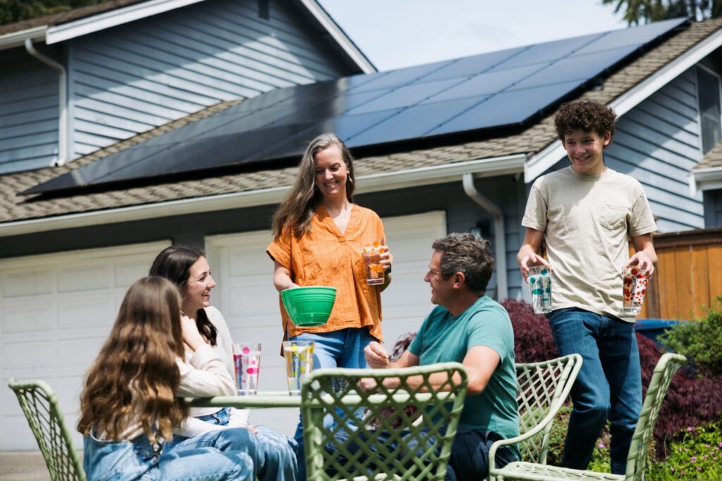 Homeowners enjoying their home minus the solar panels that cause financial stress due to a misleading solar lease. 