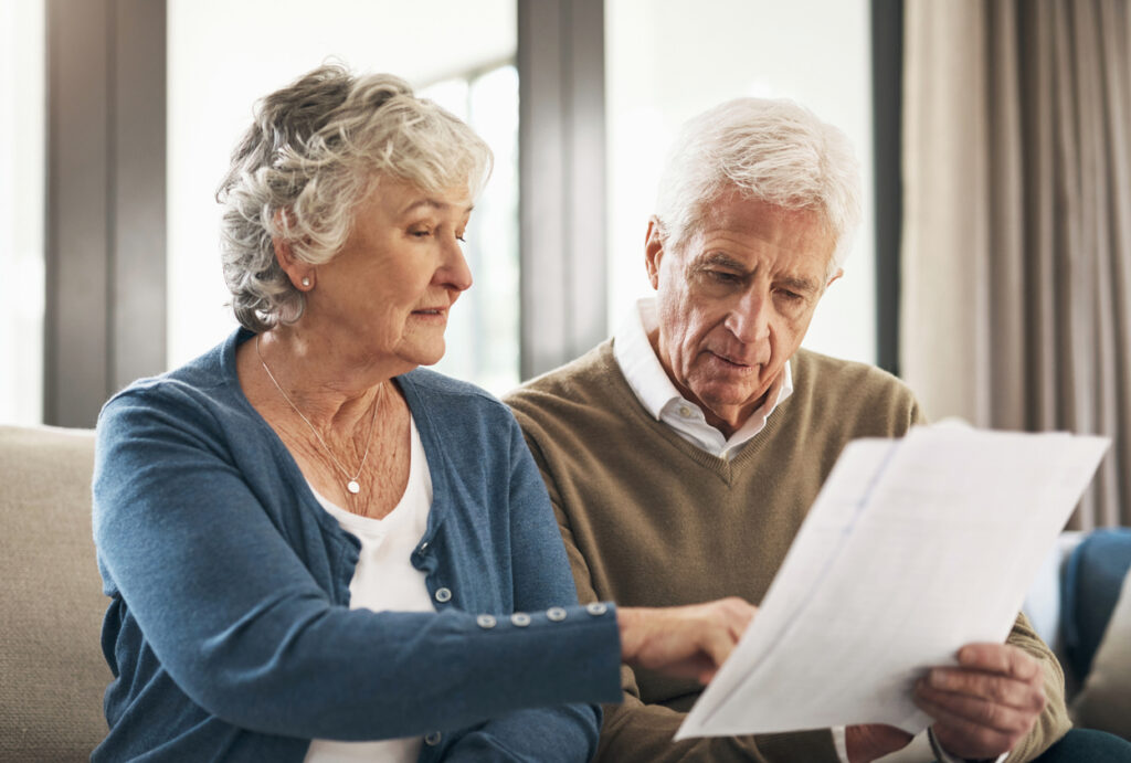 Homeowners looking over documents after speaking with an intake specialist from Solar Cancellation Resource Center.