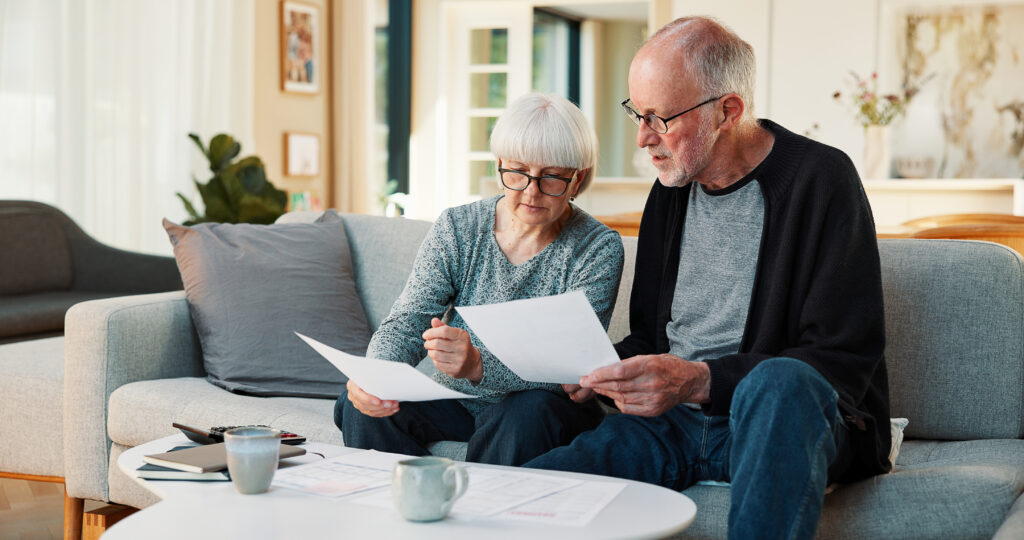 Homeowners looking over their solar contract after speaking with an intake specialist at Solar Cancellation Resource Center. 