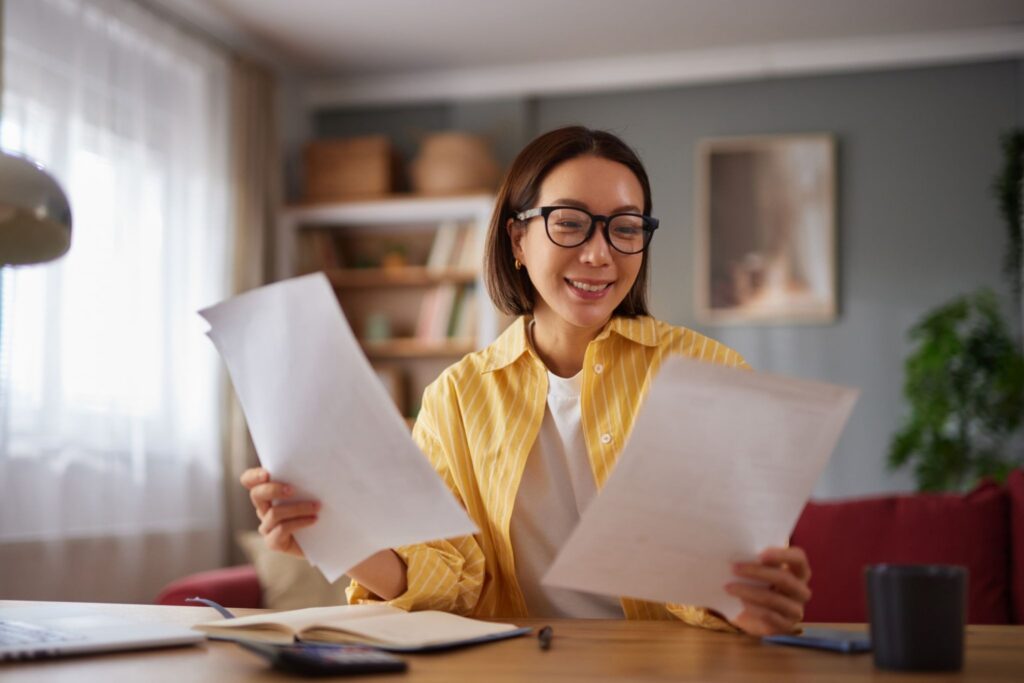A homeowner looking at her contract after successfully canceling it after using Solar Cancellation Resource Center and Consumer Advocacy Law Group. 