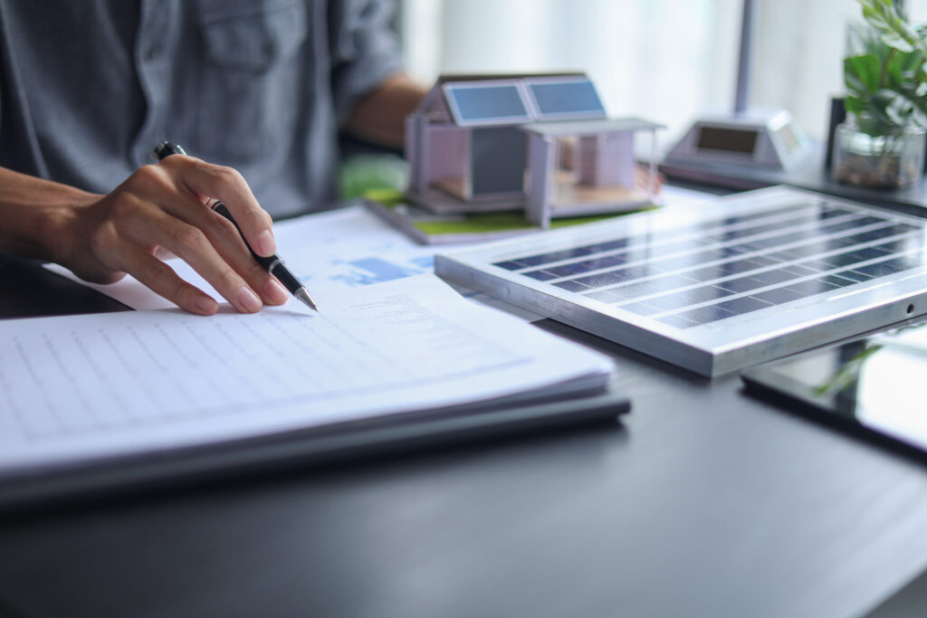 A member of Solar Cancellation Resource Center looking over a homeowners contract. 
